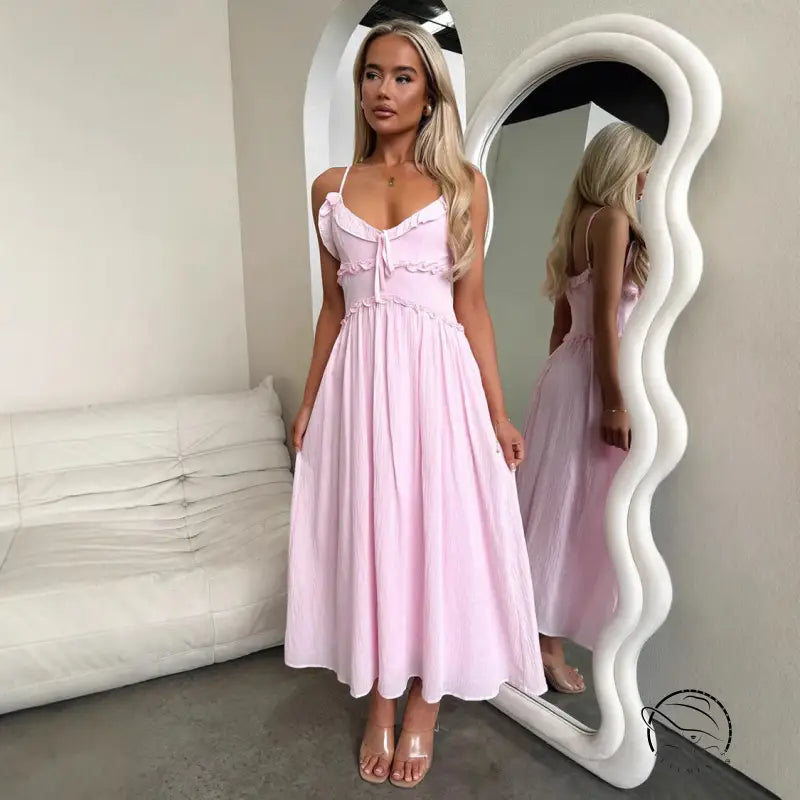 Pink spaghetti-strap midi elegant loose dress with fitted bodice and flowing skirt