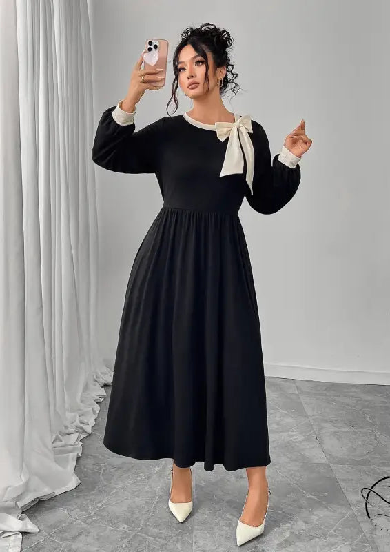 Winter retro slim black dress with white bow and pleated skirt