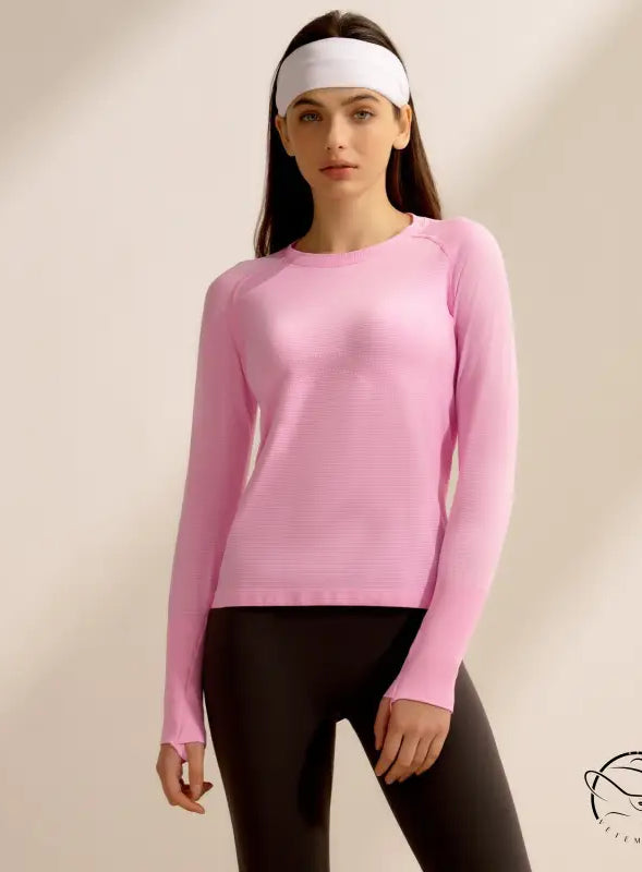 Pink langry quick-drying running top with black leggings and white headband