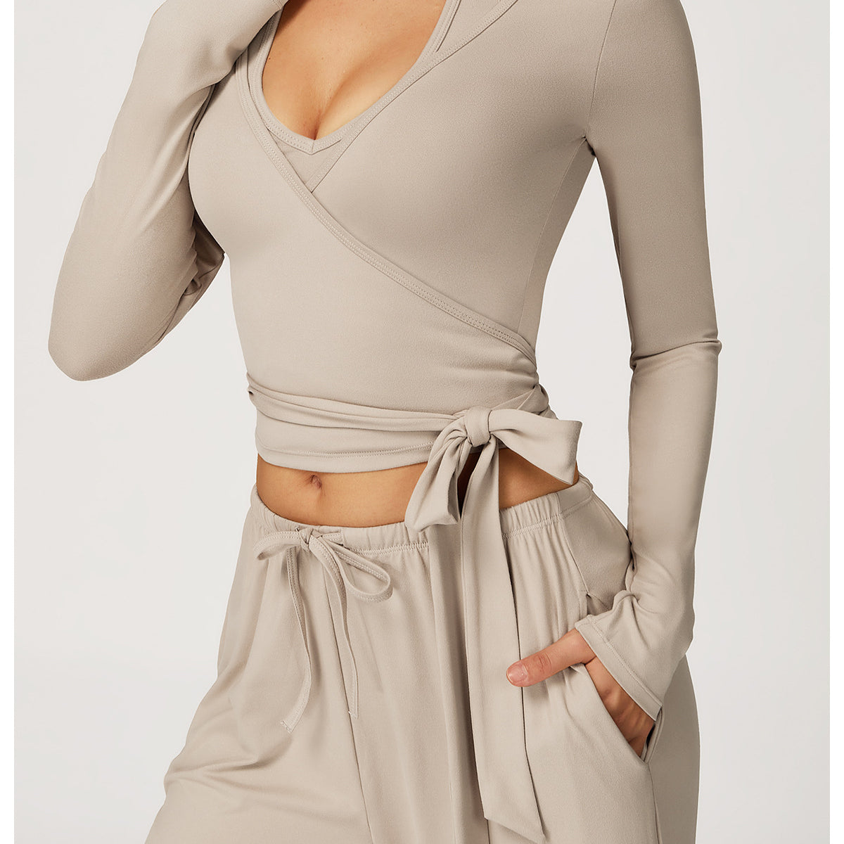 Beige Langry fashion wrap crop top with long sleeves and tie waist for yoga