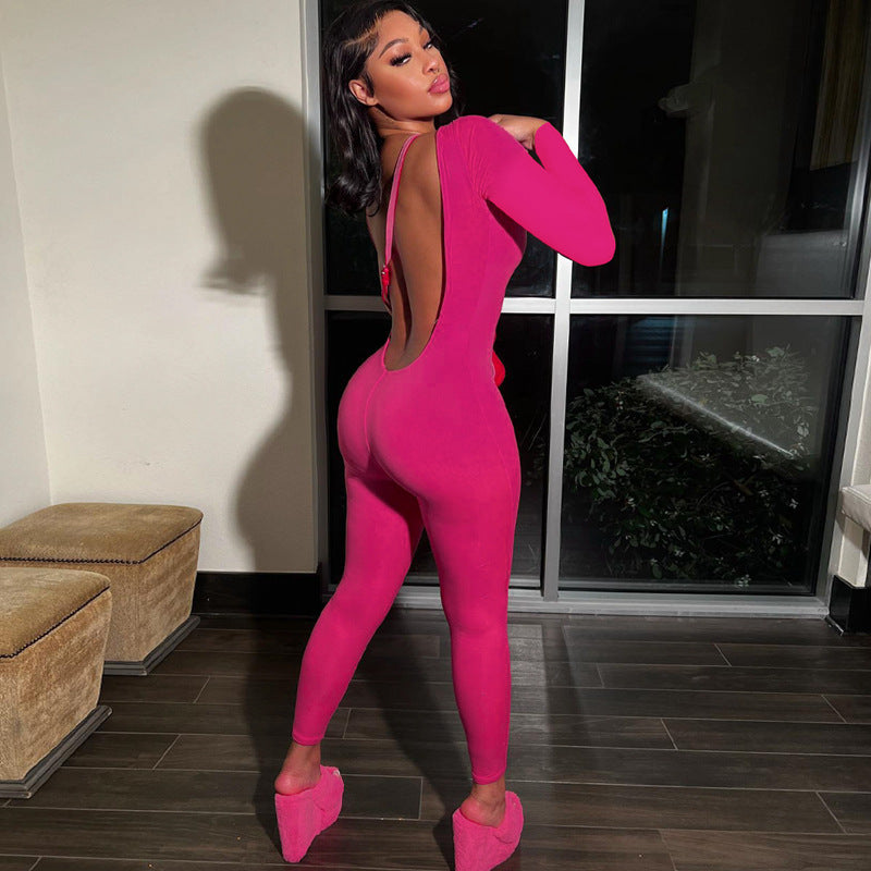 Woman in pink jumpsuit and platform shoes showcasing Langry fashion ملابس style