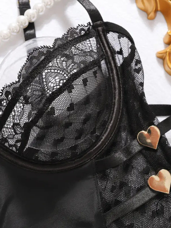 Black lace bra with gold hearts, polka dot lace accents and adjustable straps