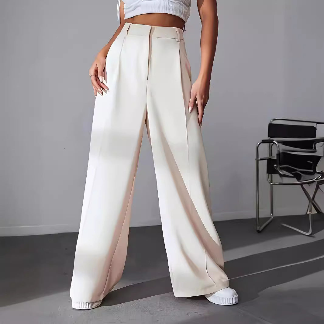 Cream-colored wide leg trousers with pleats, perfect for women’s fashion and work attire