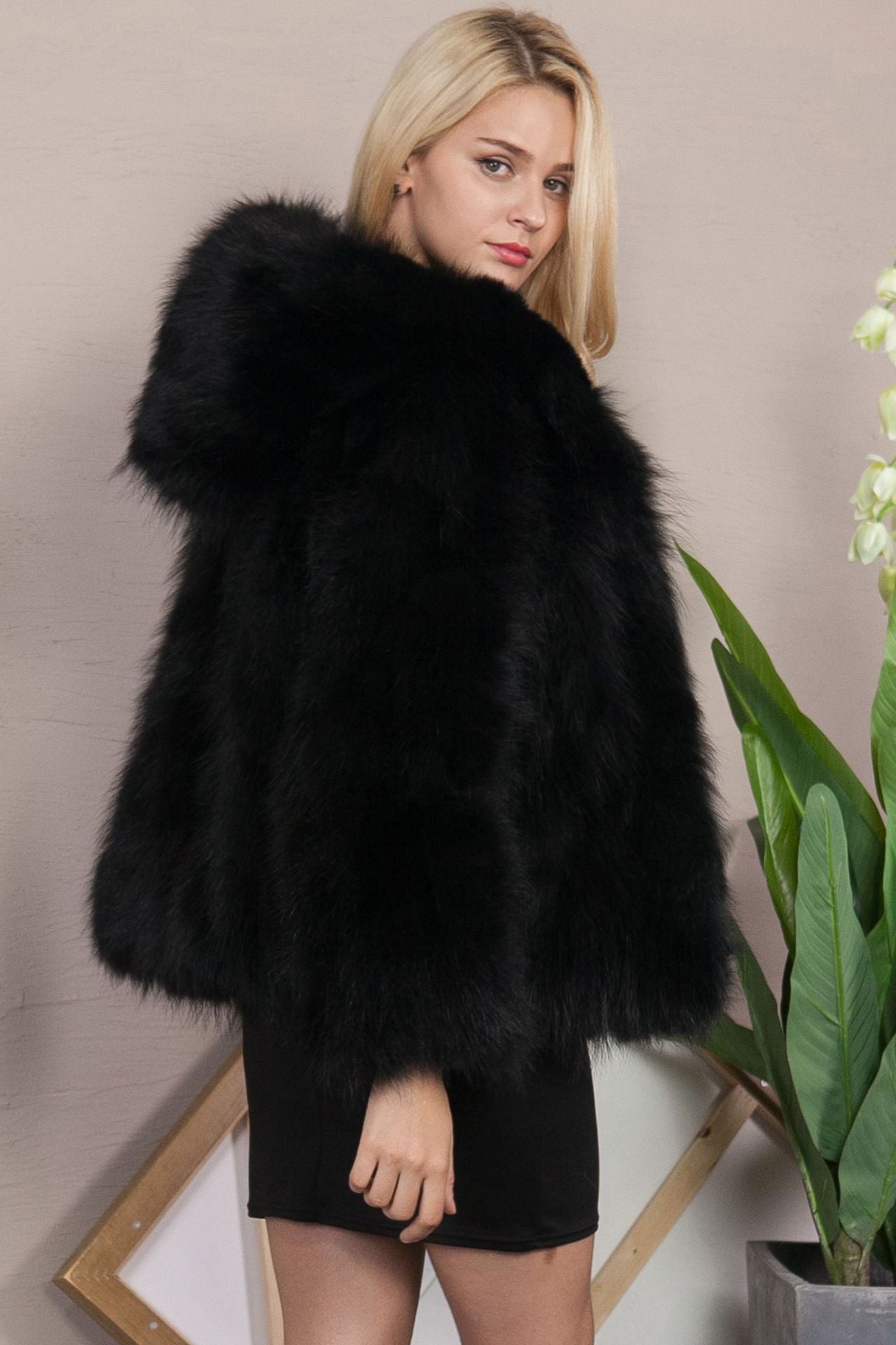 Cozy black faux fur coat with plush voluminous hood from Langry fashion