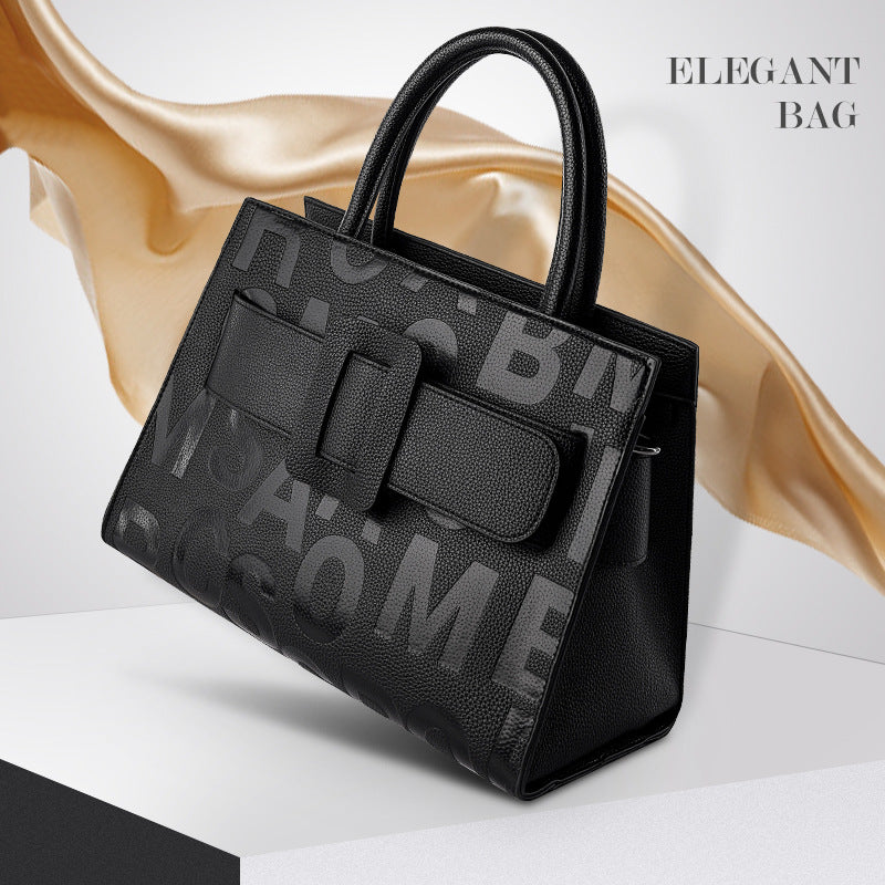Elegant black leather handbag with textured lettering for stylish fashion enthusiasts