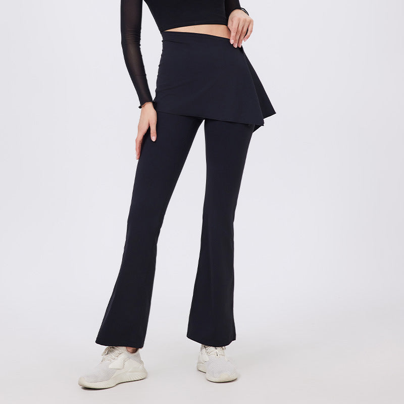 Black flared yoga pants with hip lifting peplum hem and white sneakers