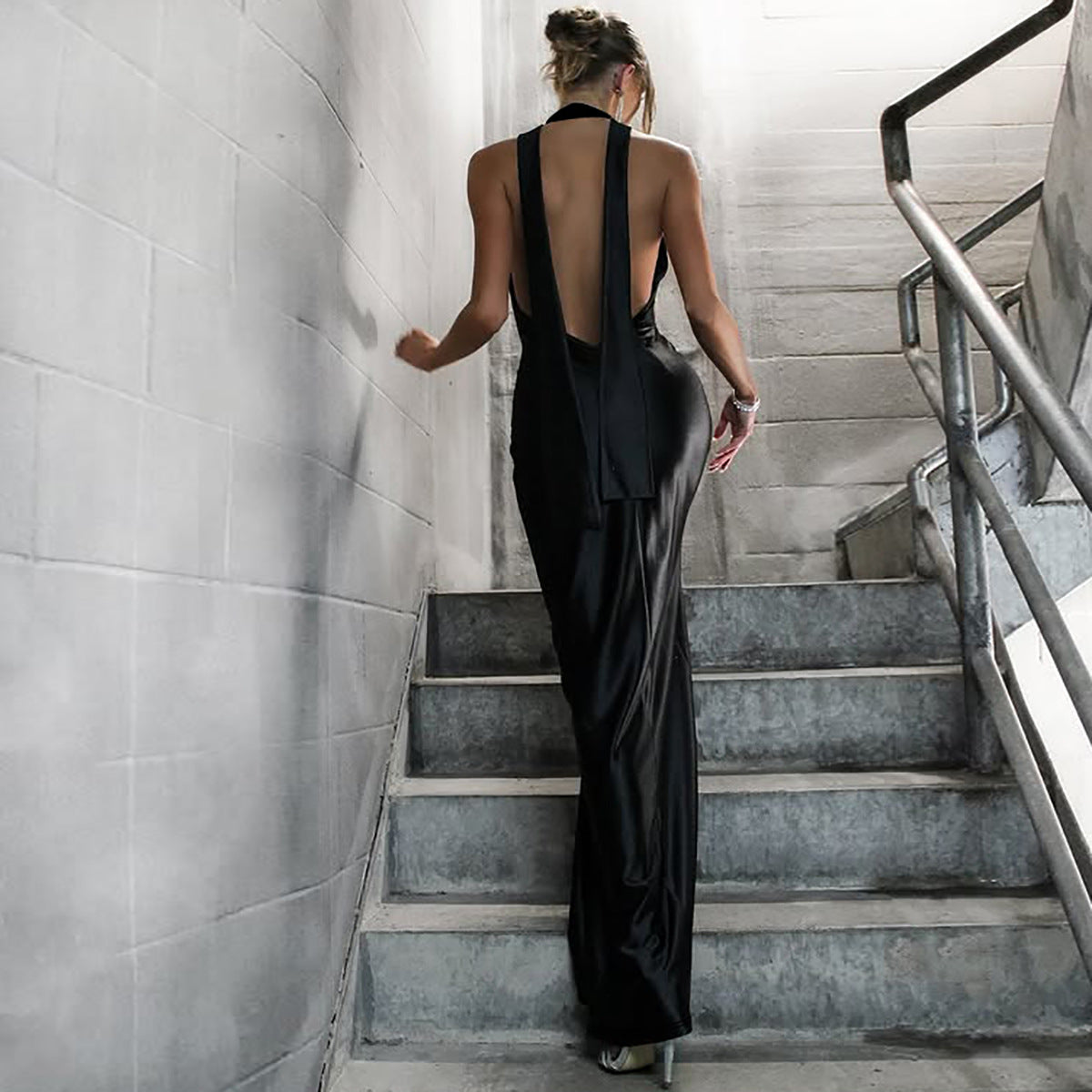 Elegant Halter Backless Ribbon Split Dress showcases a chic backless black gown in fashion