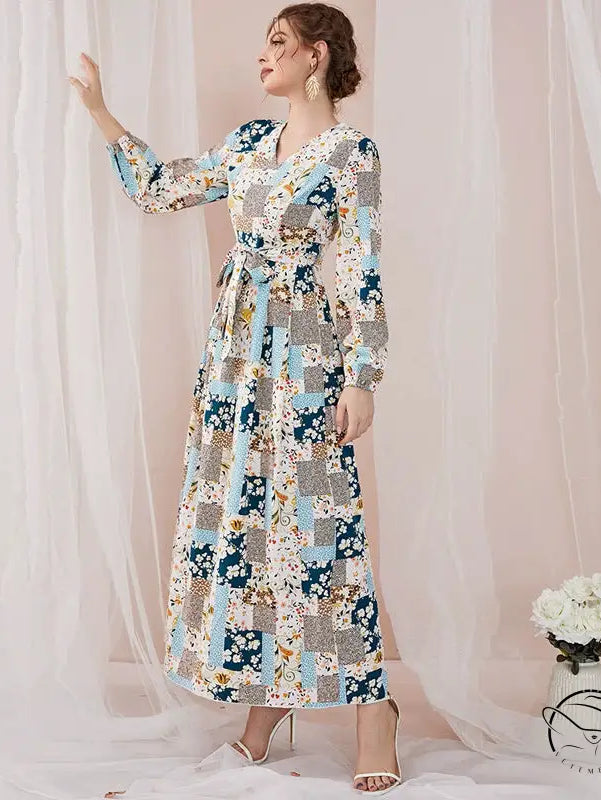 Woman in floral print slim fit maxi dress with patchwork patterns