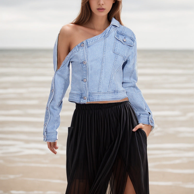 Asymmetrical denim jacket with off-the-shoulder design showcasing trendy fashion style