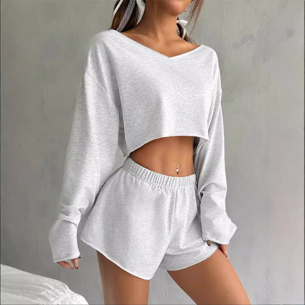 Gray lounge set featuring a long sleeve blouse and shorts for stylish winter fashion