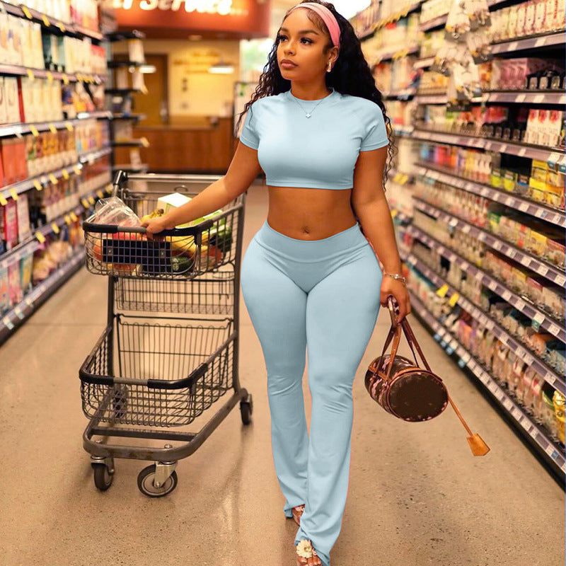 Woman in matching blue slim fit high waist suit showcasing stylish high waist suit attire