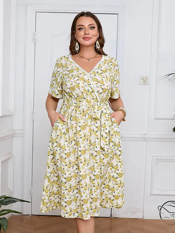 Boho lace floral dress: woman in V-neck knee-length print with cinched waist