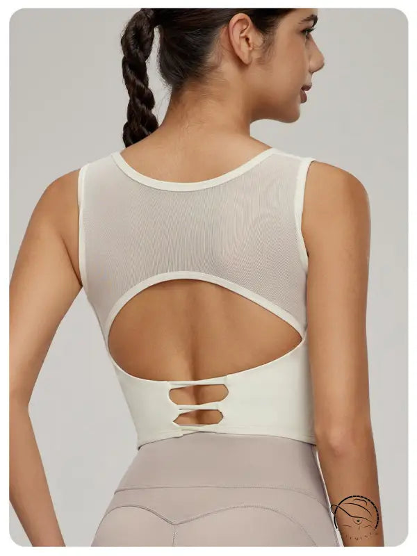 Woman modeling Beauty Back Mesh Workout Top with langry fashion mesh upper back