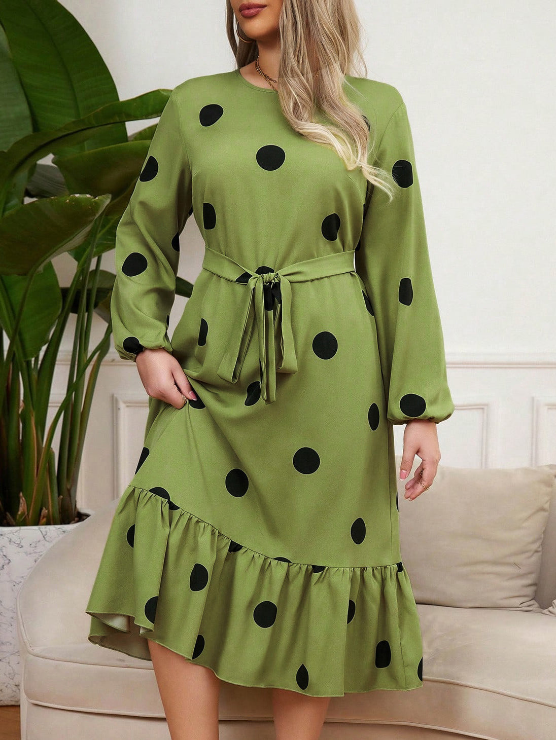 Green midi Lotus Leaf Dress with black polka dots and ruffled hem for elegant style