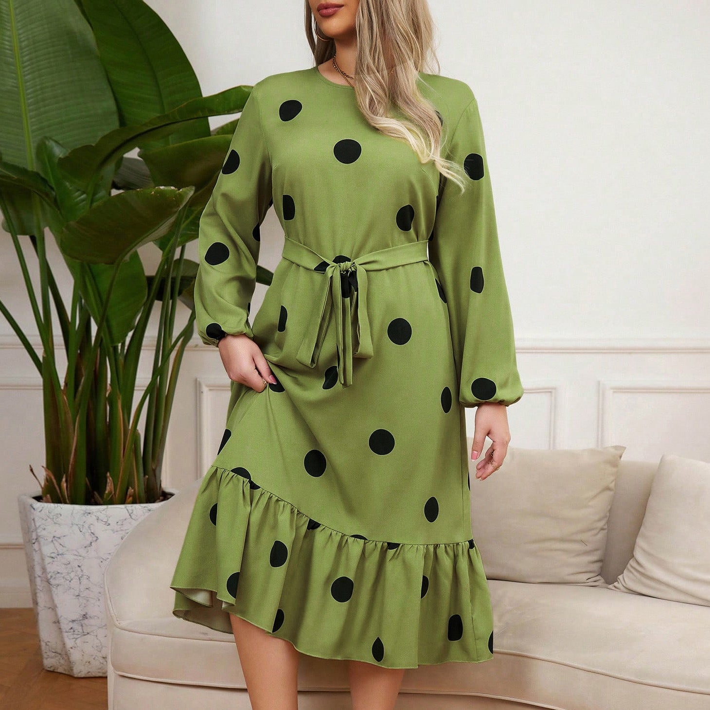 Green midi Lotus Leaf Dress with black polka dots and ruffled hem for elegant style