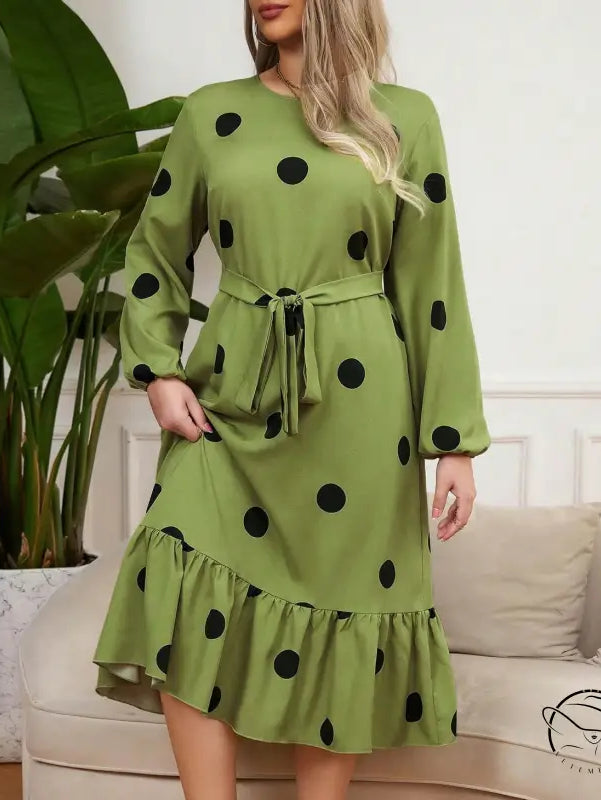 Green lotus leaf dress with black polka dots and ruffled hem