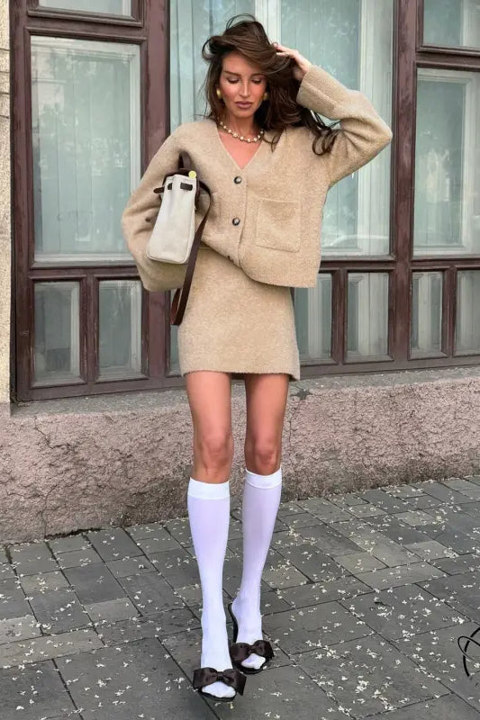Beige oversized langry cardigan with pockets, white knee-high socks outfit