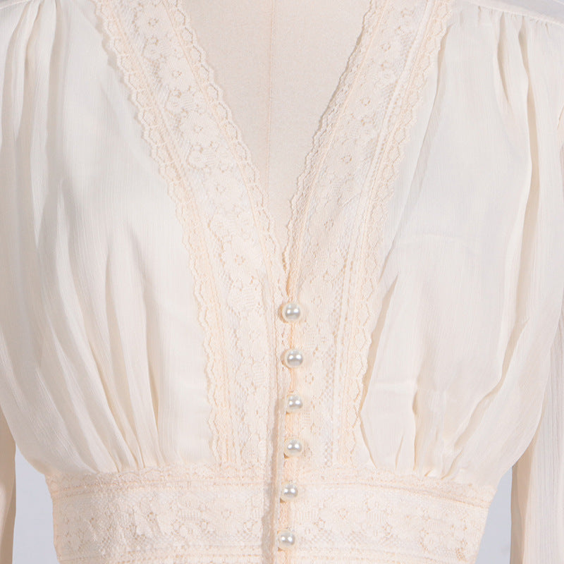 Cream-colored lace-trimmed blouse from Langry fashion collection, perfect for ملابس