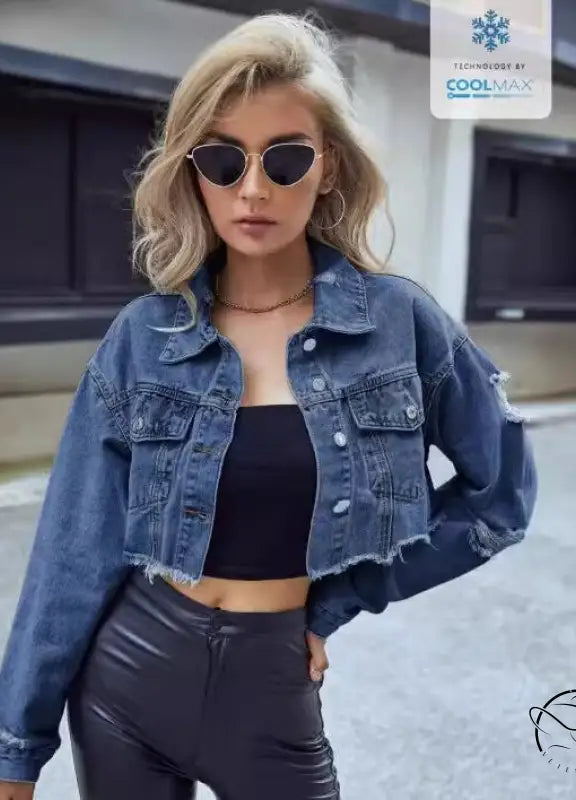 Woman in matching denim short coat with tube top and dark pants