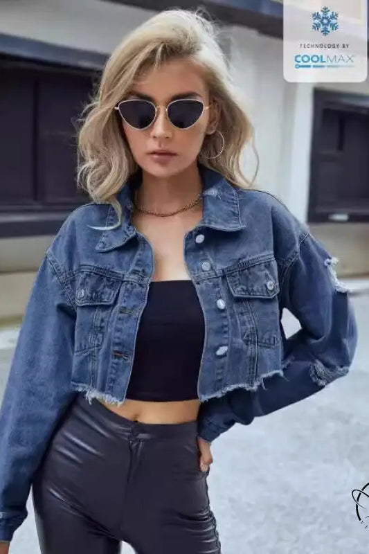 Woman in matching denim short coat with tube top and dark pants