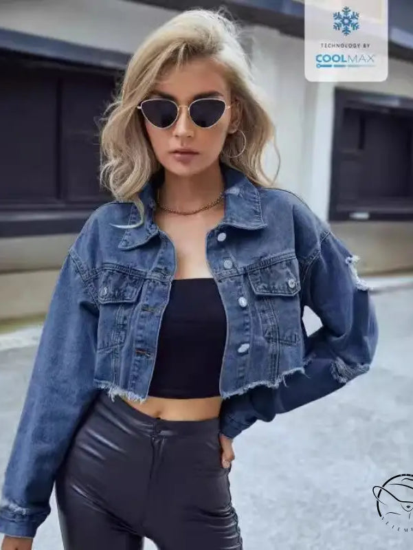 Woman in matching denim short coat with tube top and dark pants