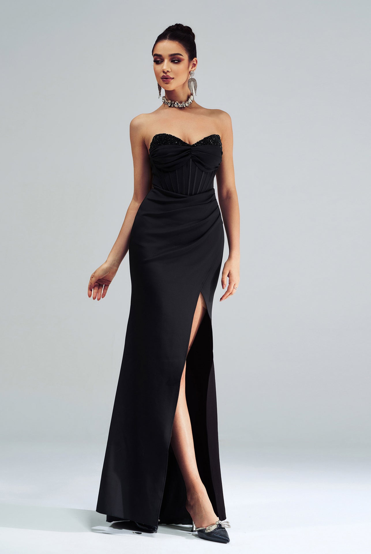 Elegant black strapless evening gown with high side slit for stunning fashion moments