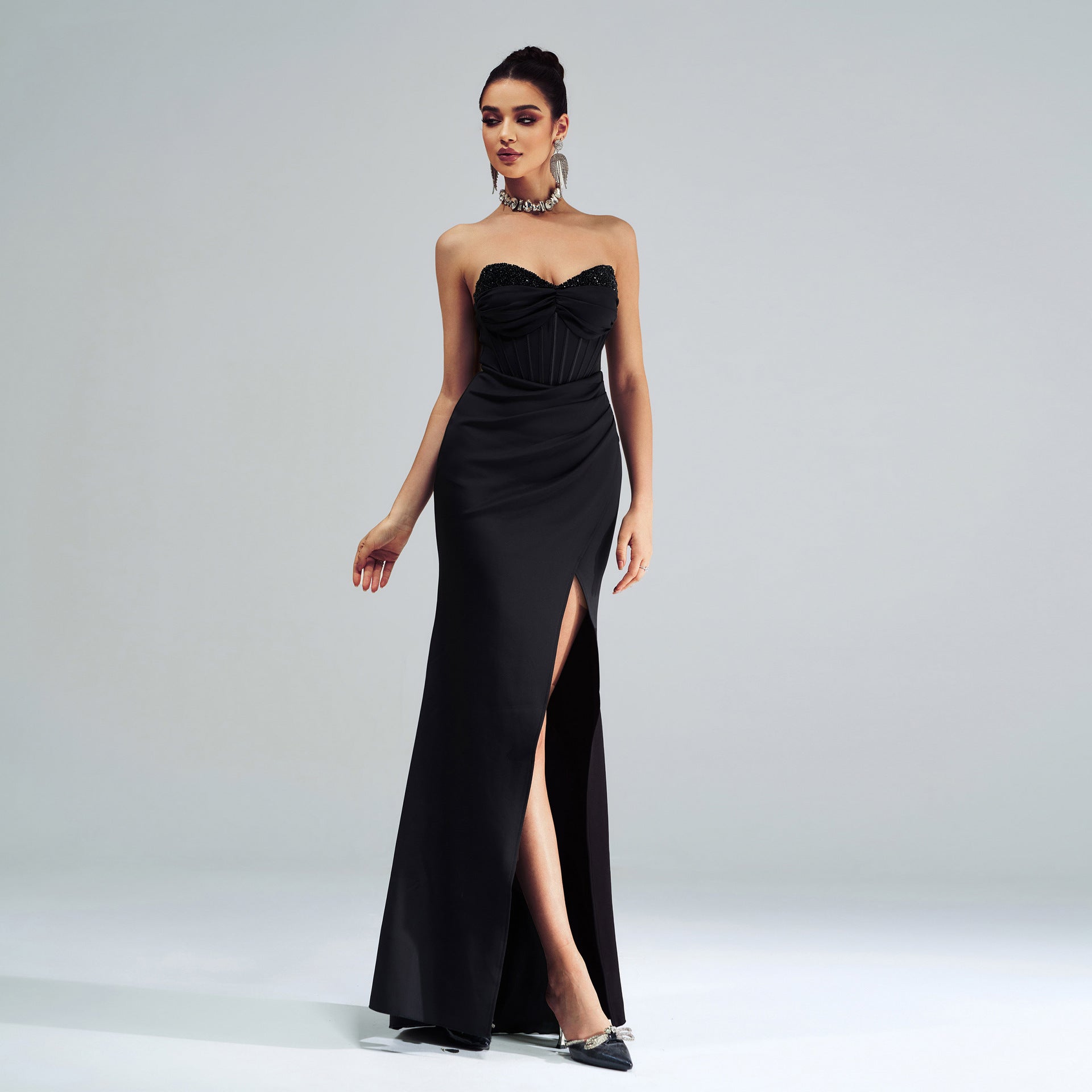 Elegant black strapless evening gown with high side slit for stunning fashion moments