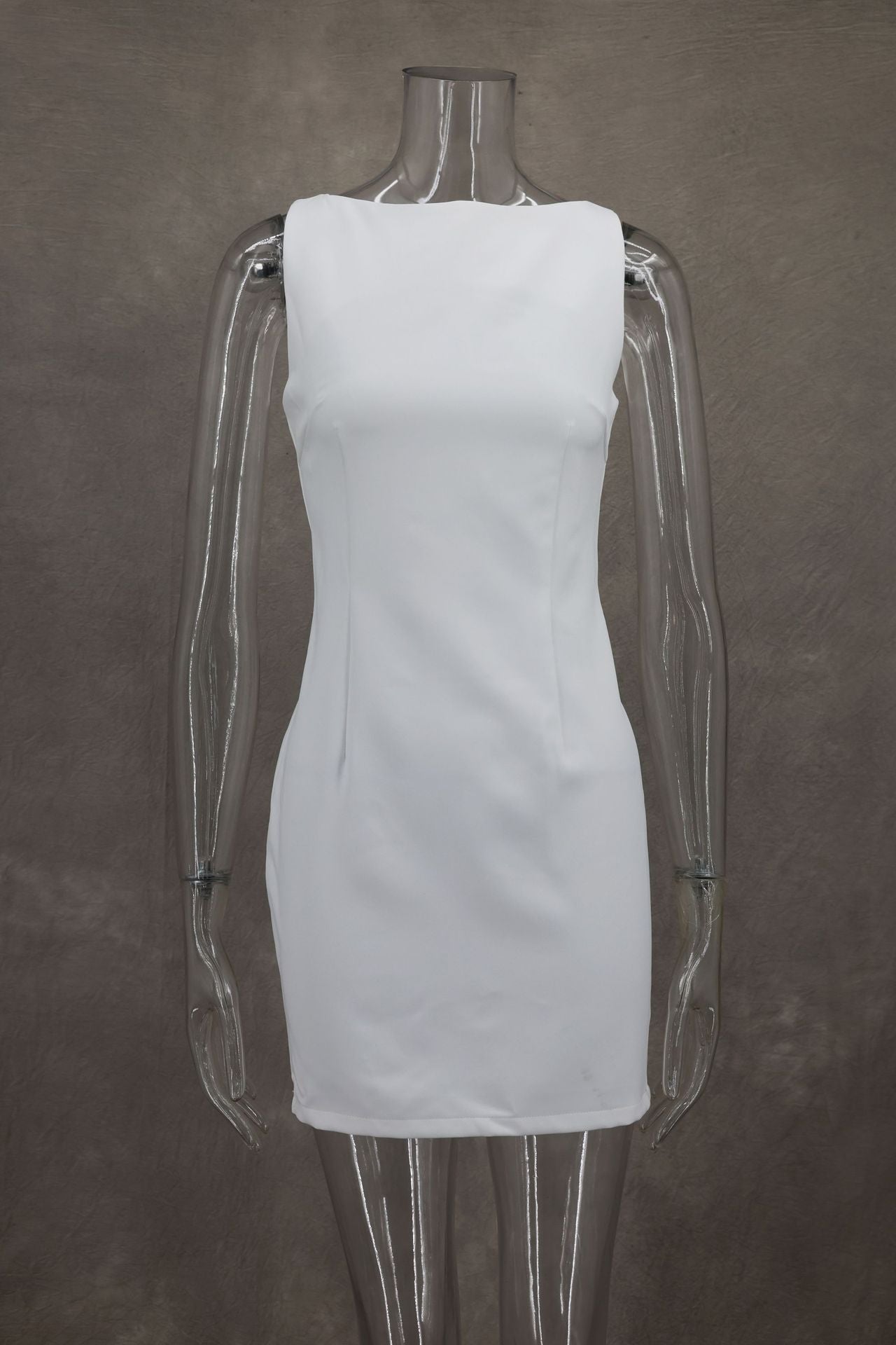 Simple white sleeveless dress on a transparent mannequin for elegant fashion ملابس