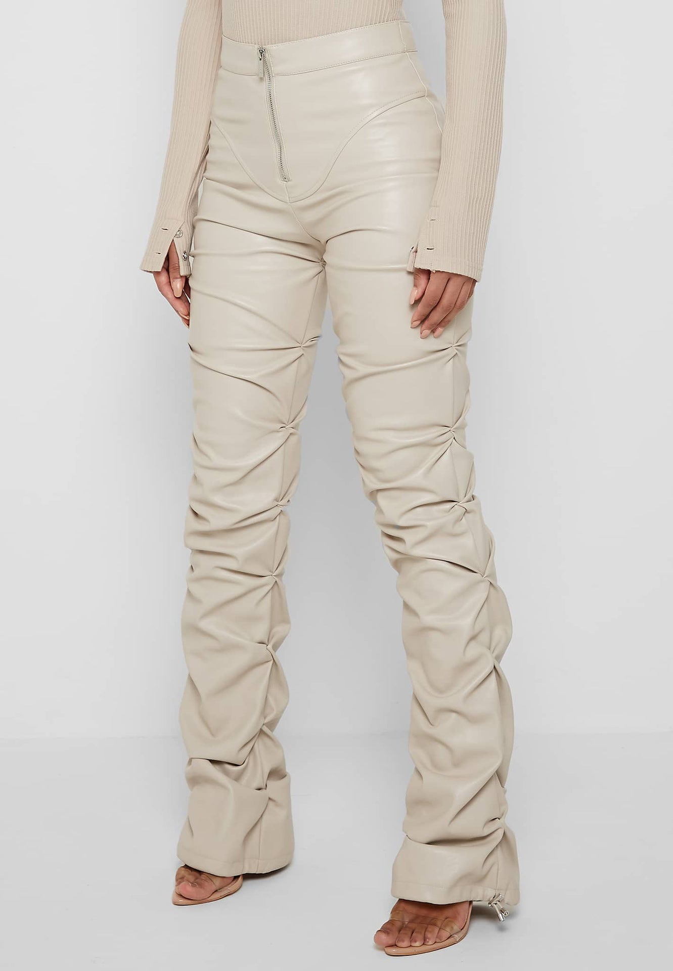 Beige ruched faux leather pants in fashion, showing style and longevity in every season