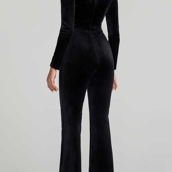 Black velvet jumpsuit with long sleeves and flared legs, ideal for langry fashion ملابس