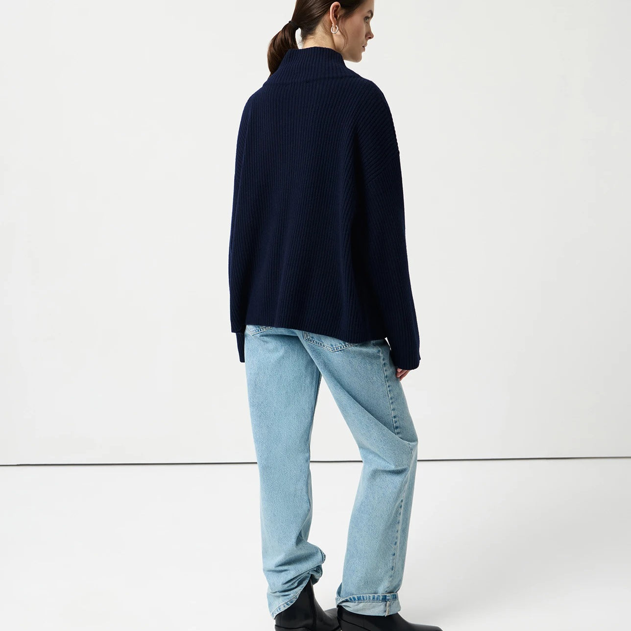 Navy blue cozy half high collar wool cardigan with black buttons and ribbed cuffs