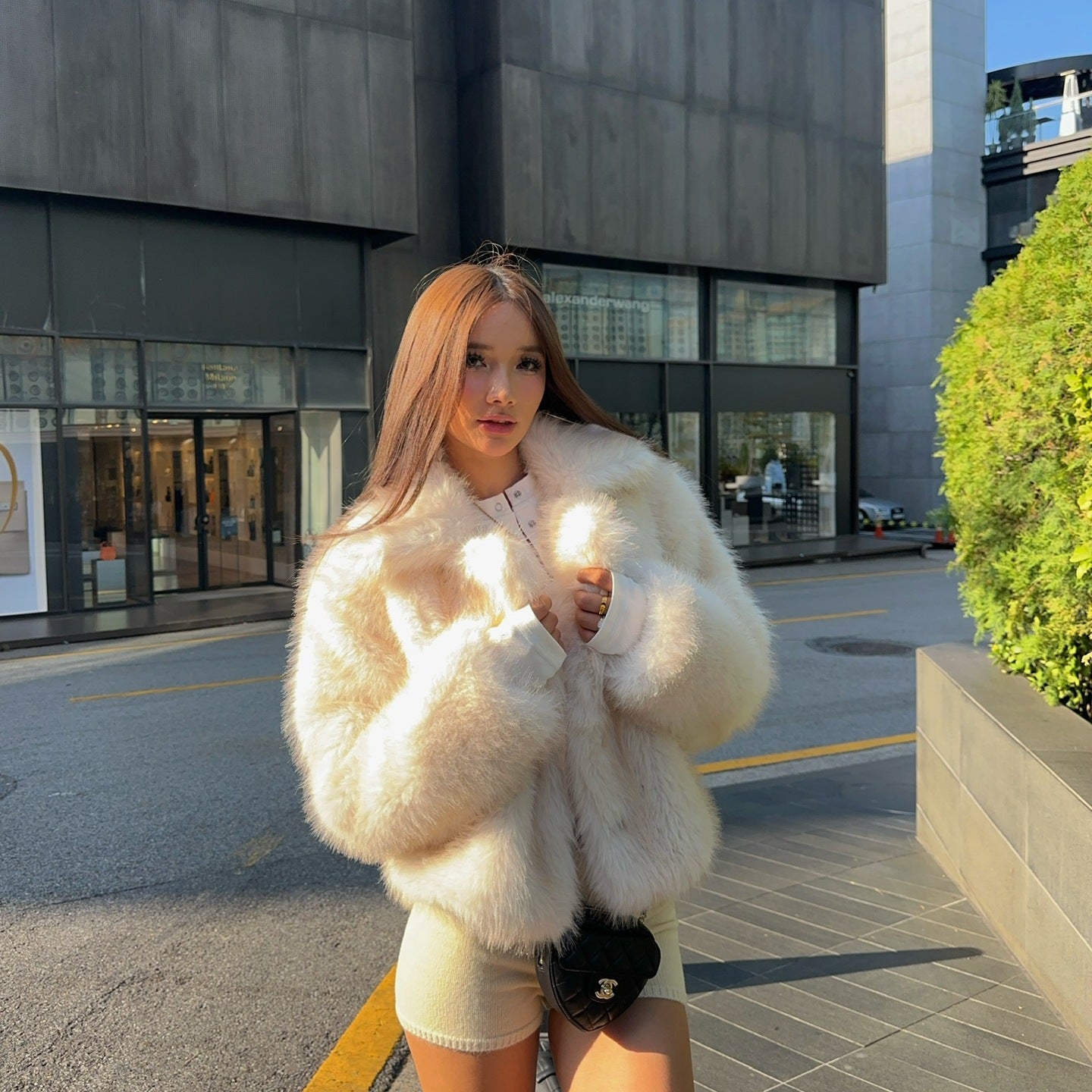 Cream faux fur oversized coat with black trim and pockets by Langry fashion