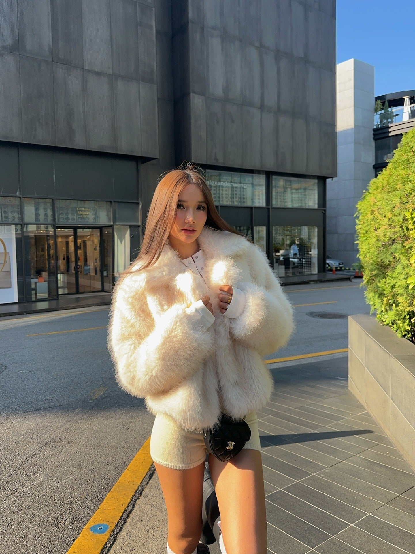 Cream faux fur oversized coat with black trim and pockets by Langry fashion