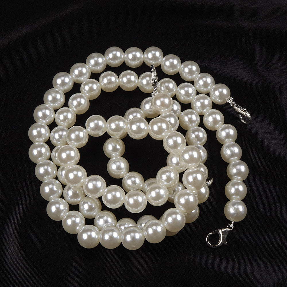 Elegant white pearl necklace with silver clasps complementing women fashion and ملابس style