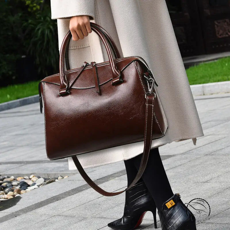 Elegant langry brown leather fashion handbag with silver hardware