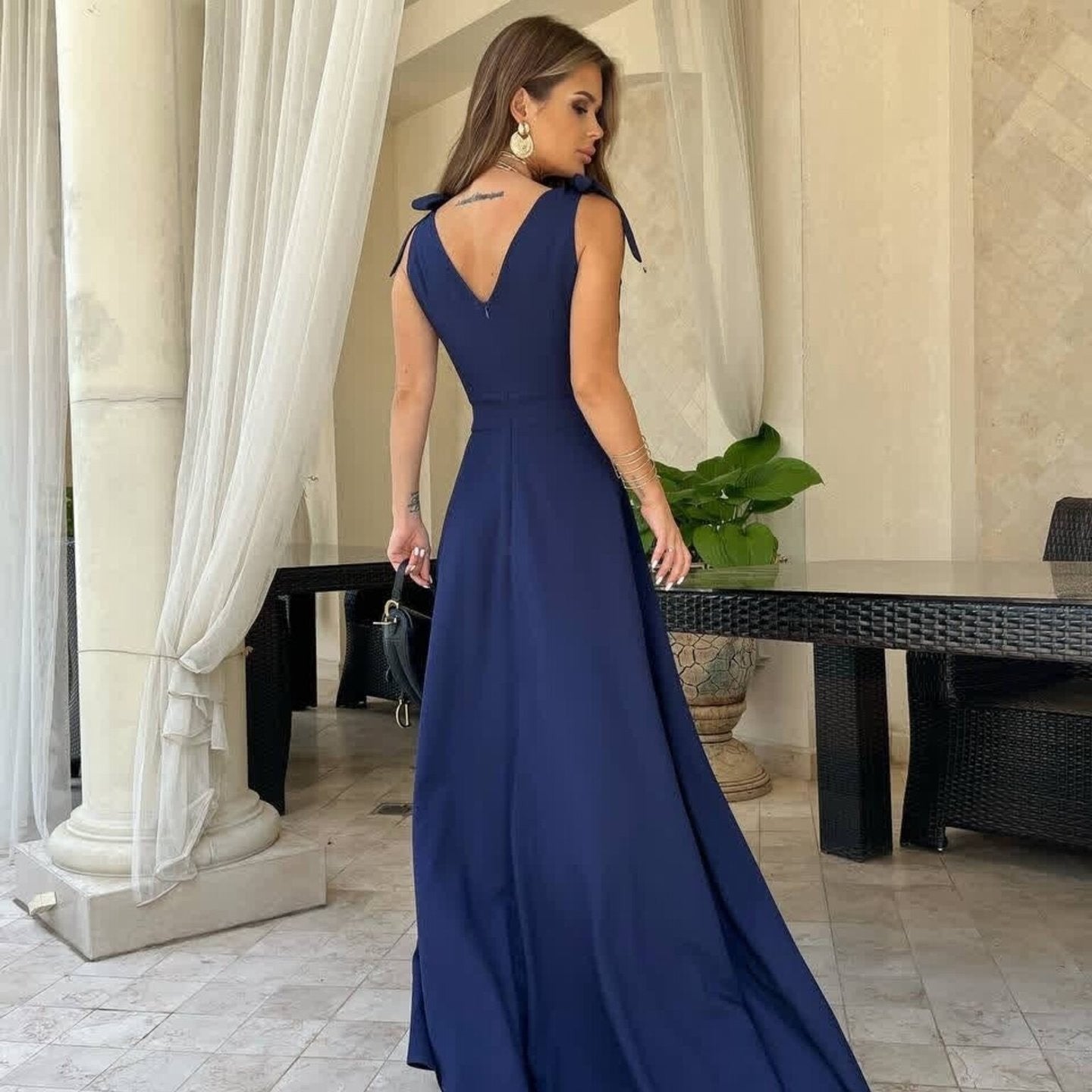 Elegant navy blue evening dress, sleeveless maxi style, perfect for formal occasions