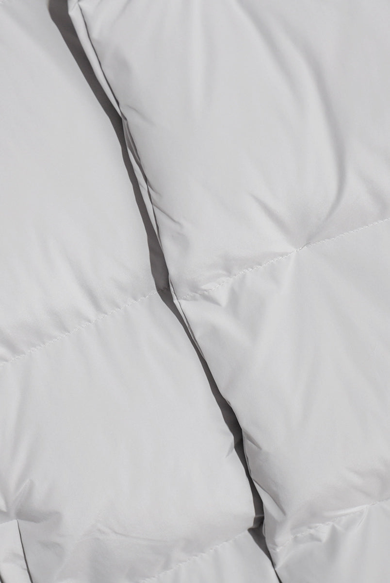 Padded white fabric of the Cotton Coat Jacket, perfect for stylish fashion ملابس