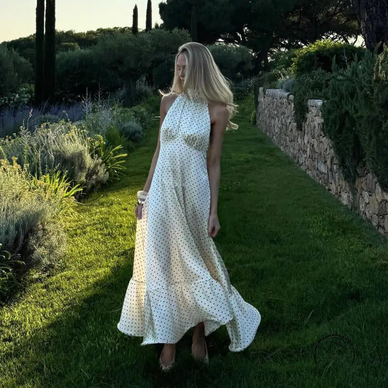 White polka dot halter neck satin maxi dress with floral lace hem