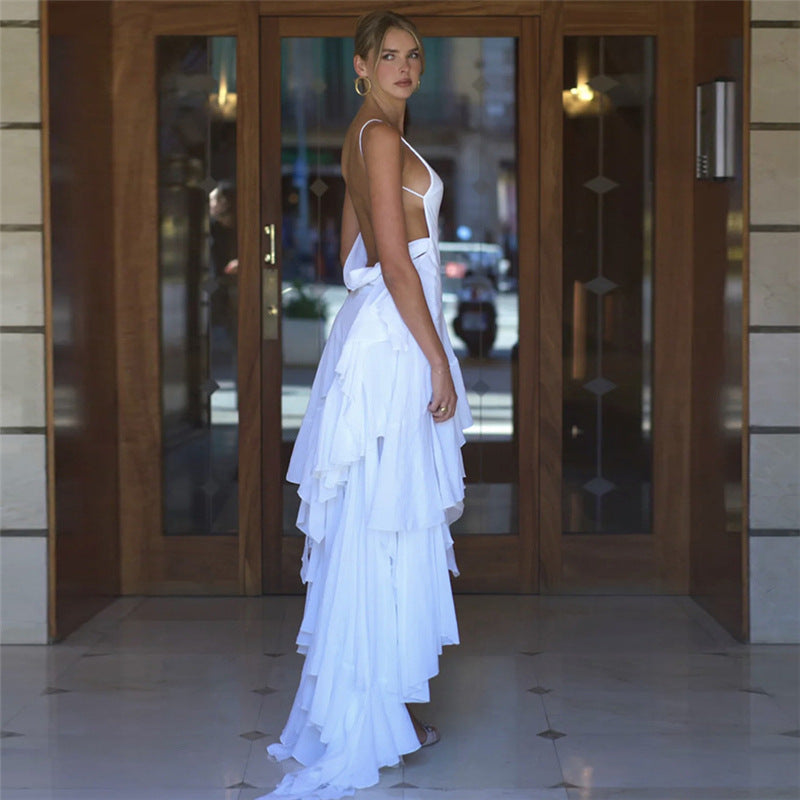 White backless tiered dress showcasing elegant summer women’s fashion and ملابس style