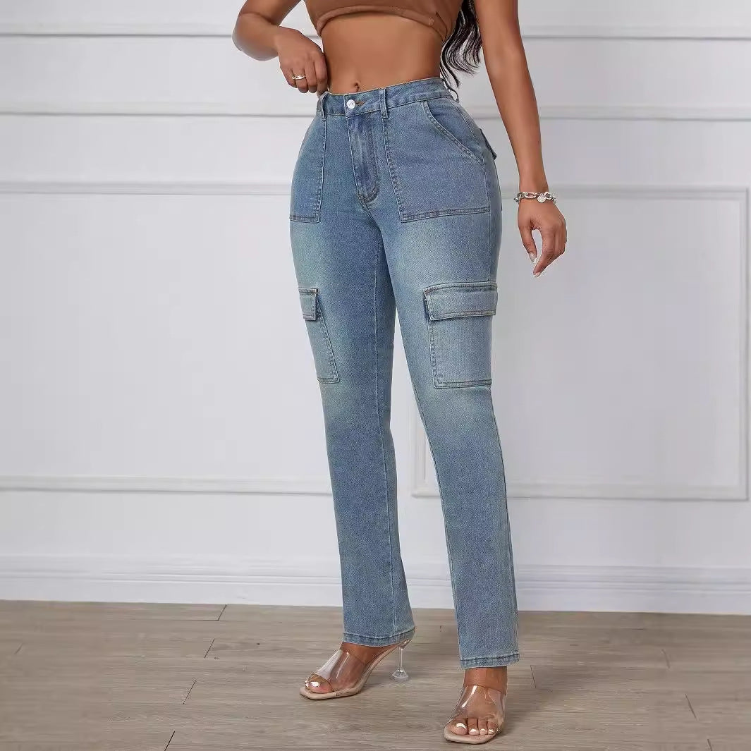 Light-wash denim cargo pants with large side pockets, styled as straight skinny jeans
