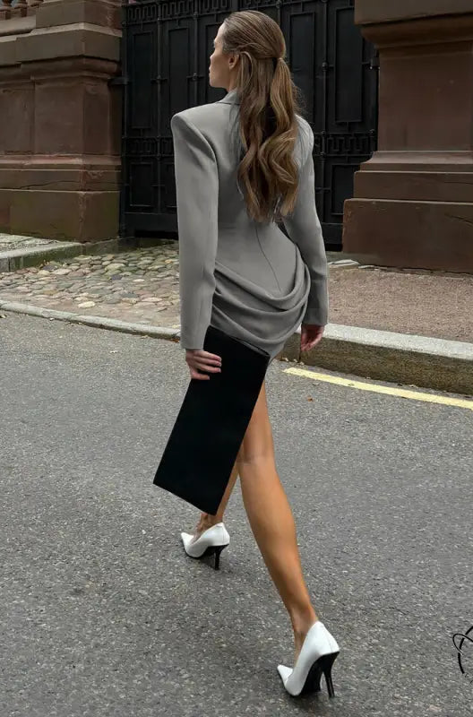 Gray and black asymmetrical blazer dress with deep v plunge neck and high slit