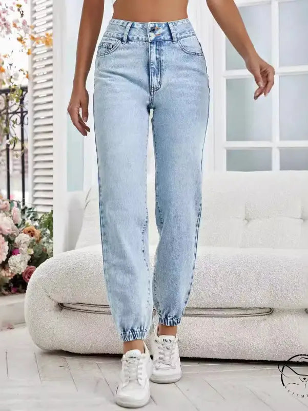 Light wash blue drooping loose denim pants with elasticized cuffs