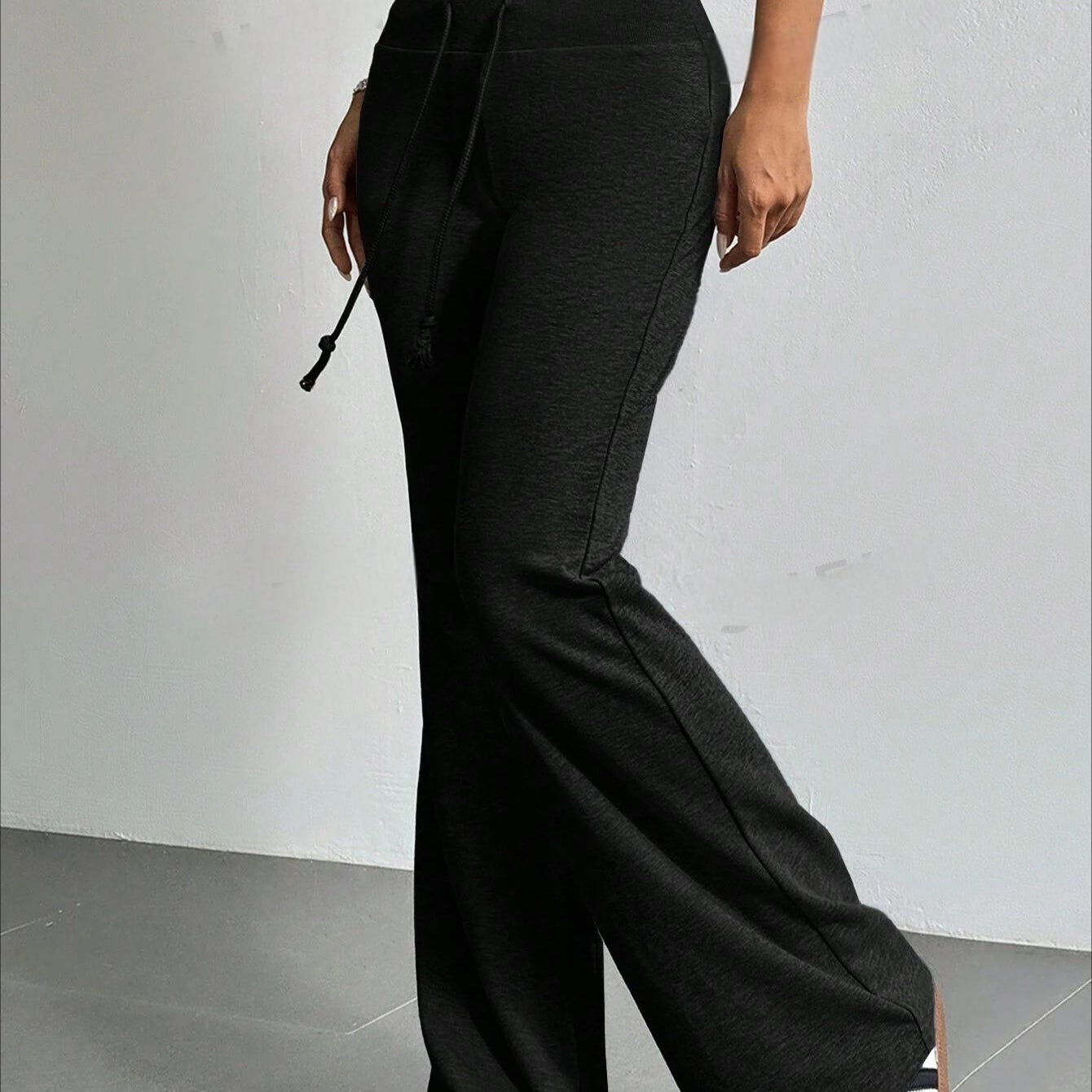 Black drawstring flared pants from the High Waist Casual Solid Color Bell Bottom Pants collection