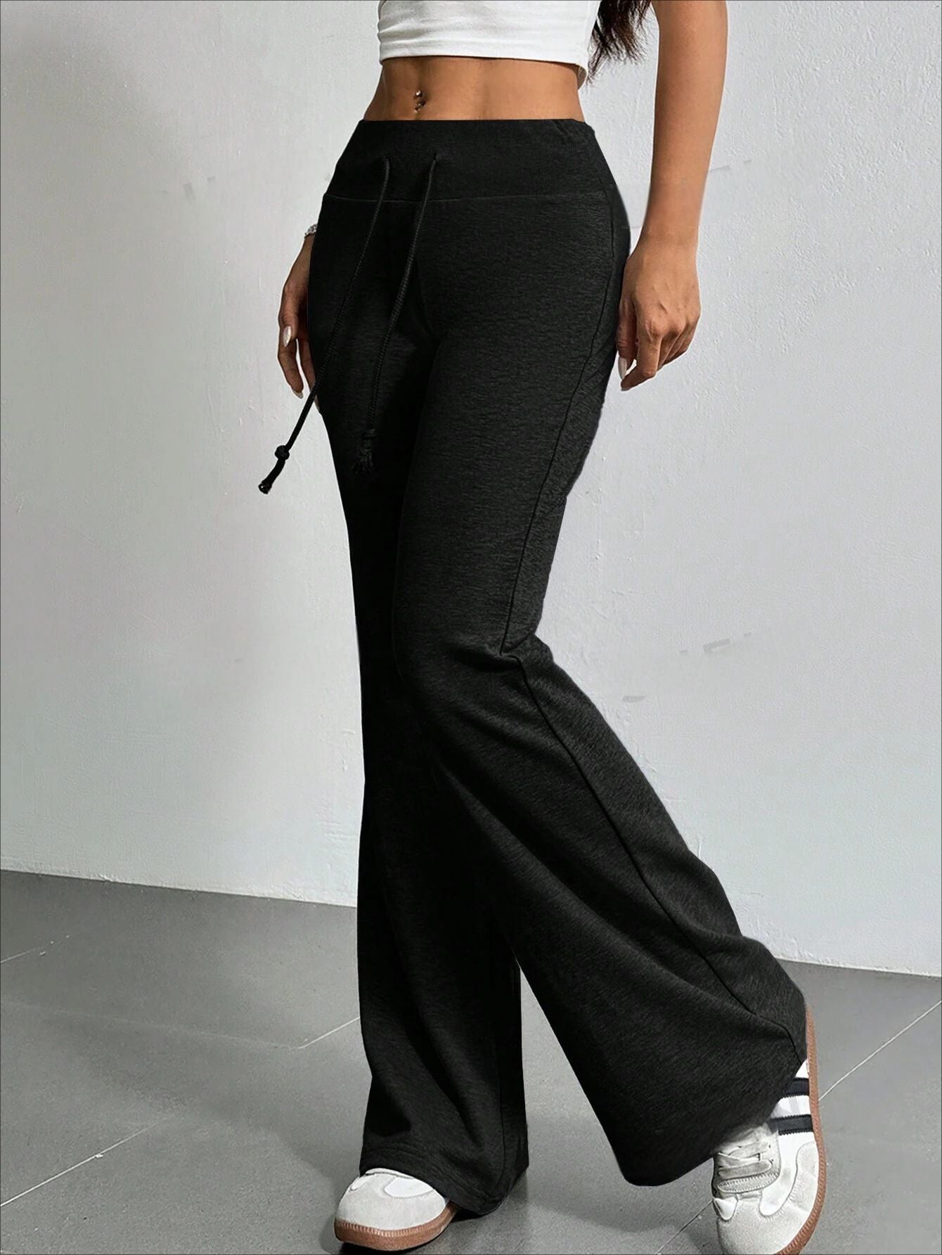 Black drawstring flared pants from the High Waist Casual Solid Color Bell Bottom Pants collection