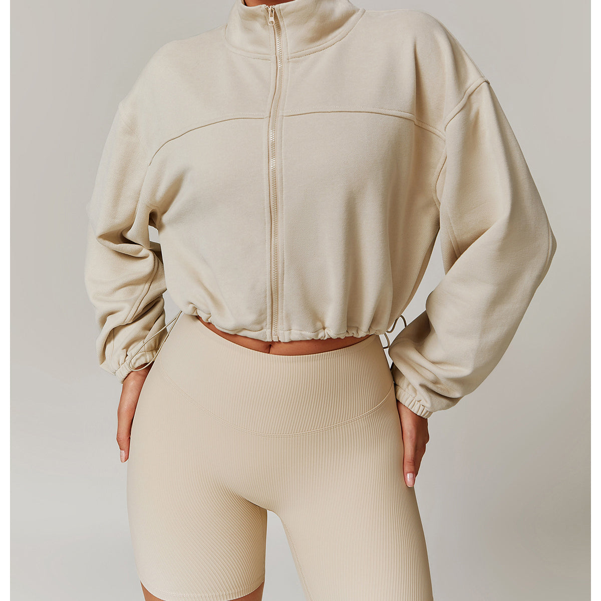 Cropped beige zip-up sweatshirt and matching biker shorts for Langry fashion ملابس
