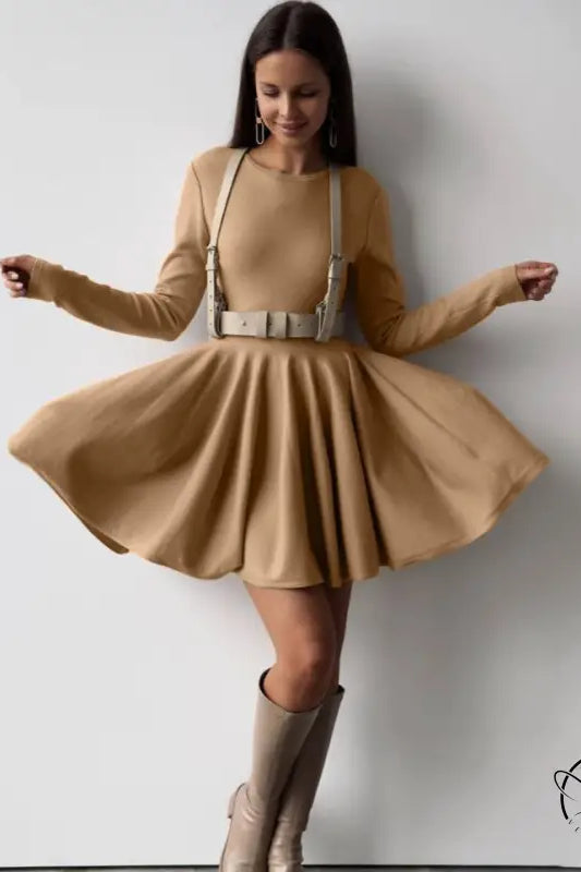 Beautiful woolen knitted dress on woman in tan dress with harness