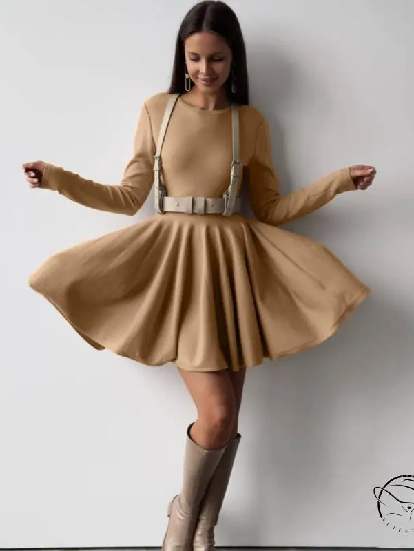 Beautiful woolen knitted dress on woman in tan dress with harness