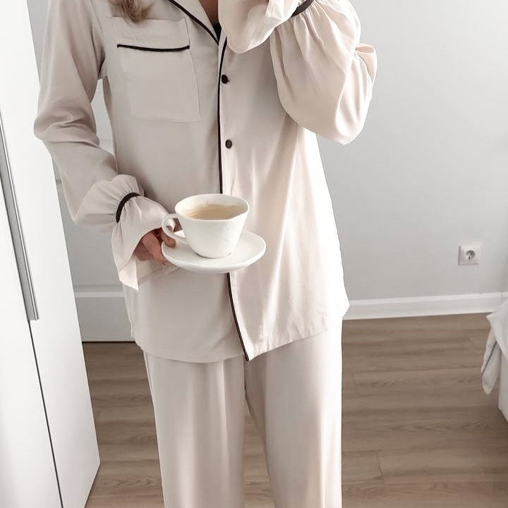 Langry fashion cream-colored collared pajama set with black piping and trousers