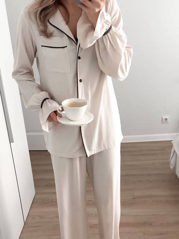 Langry fashion cream-colored collared pajama set with black piping and trousers