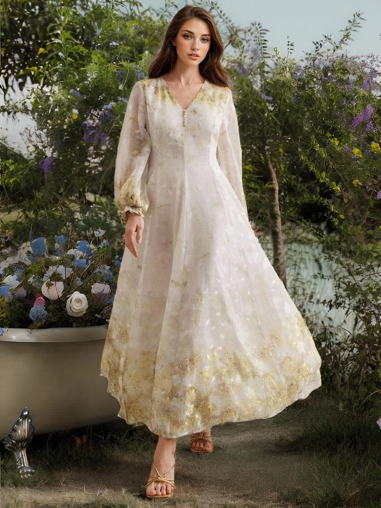Enchanting white embroidered organza maxi dress with gold accents and lace details